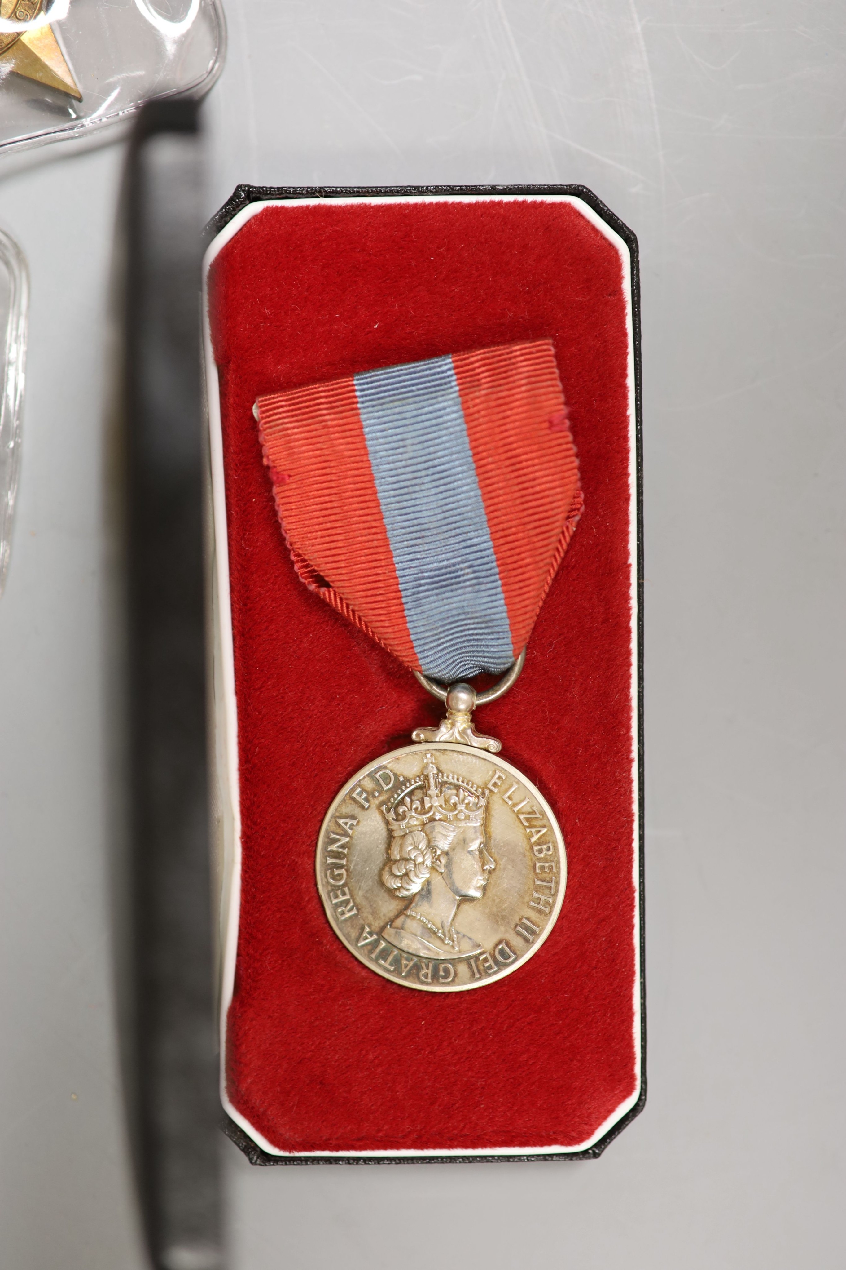 A large collection of unnamed WWII medals and spare ribbons and a cased QEII Imperial Service Medal to John Henry Hope